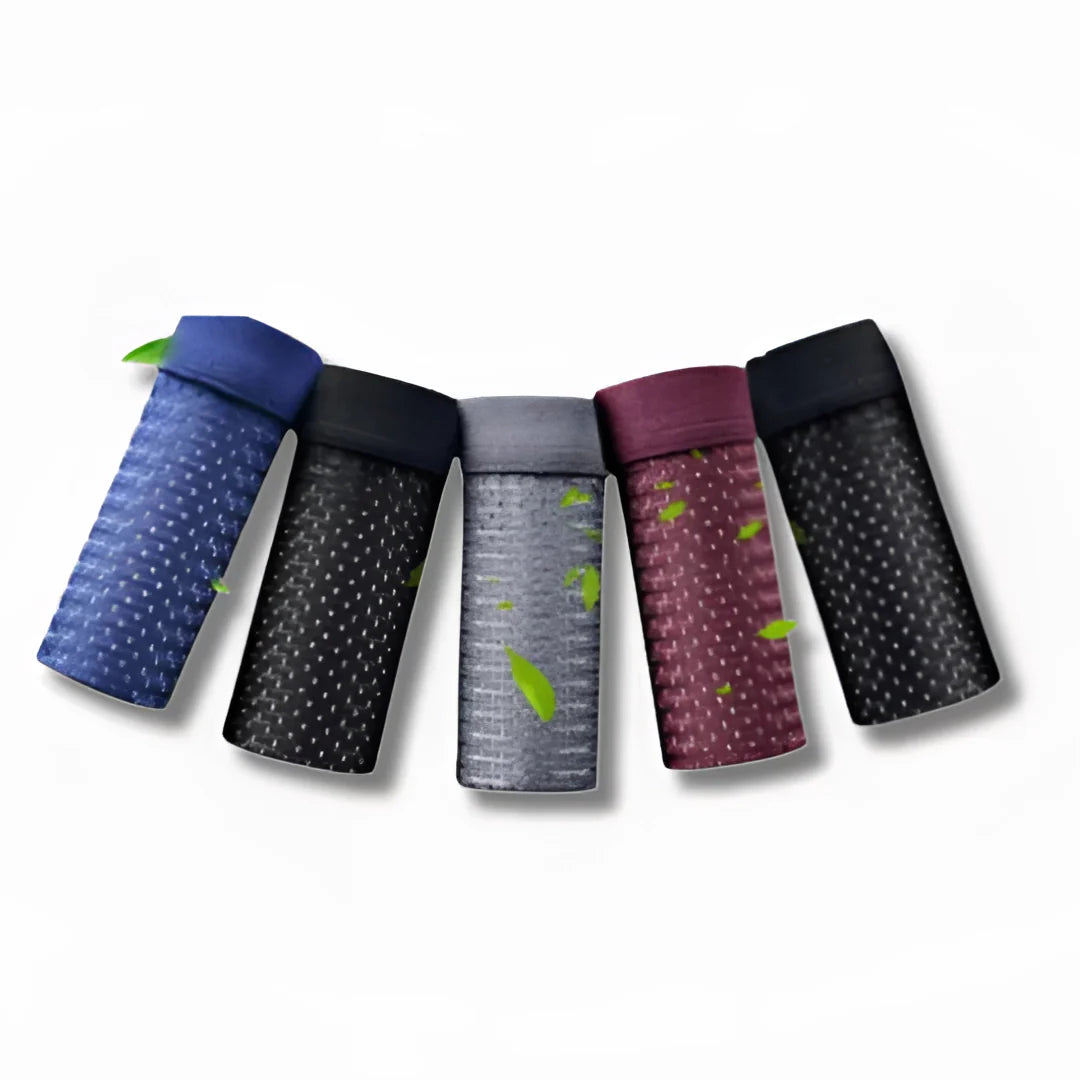 Men's moisture-wicking mesh boxer briefs in a variety of colors, including purple and magenta, displayed in a rectangular packaging.