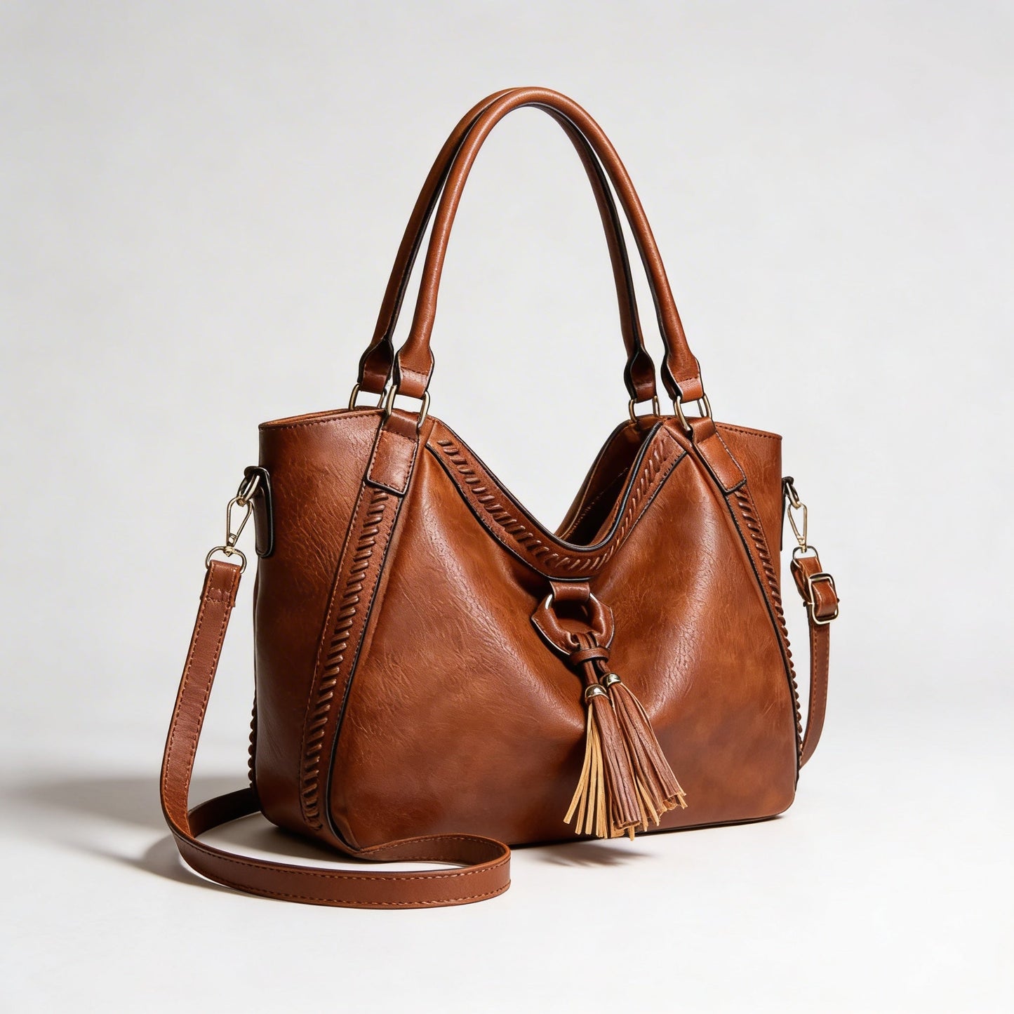 Vera | Women’s Crossbody Bag With Tassel Accent And Bold Stitch Detailing | Modern