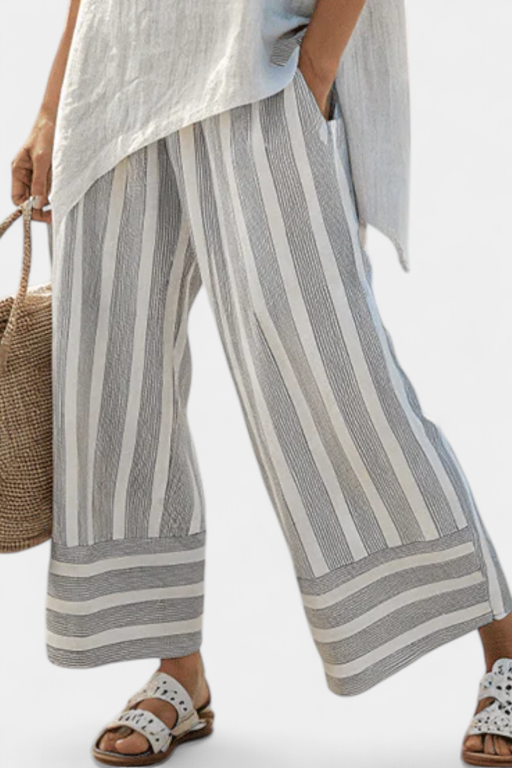 Elle – Elegant Asymmetric Blouse and Striped Trousers