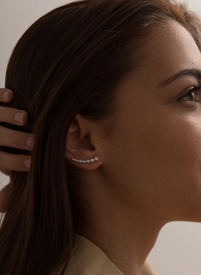 Silver climber earrings with sparkling crescent cubic zirconia