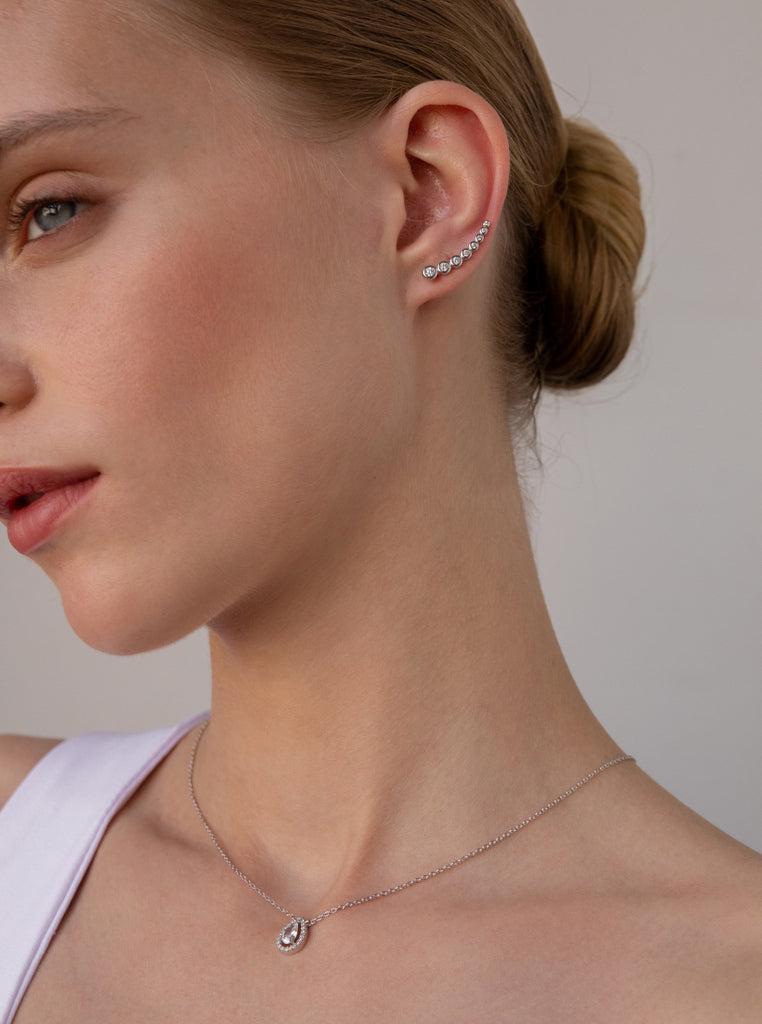 Silver climber earrings with sparkling crescent cubic zirconia