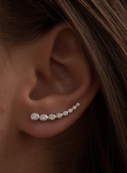 Silver climber earrings with sparkling crescent cubic zirconia
