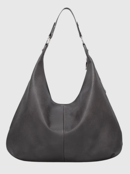 Sort læderhåndtaske med hobo-design, justerbar rem og sølvdetaljer. Stilfuld og praktisk til hverdagsbrug. Perfekt til modebevidste kvinder.