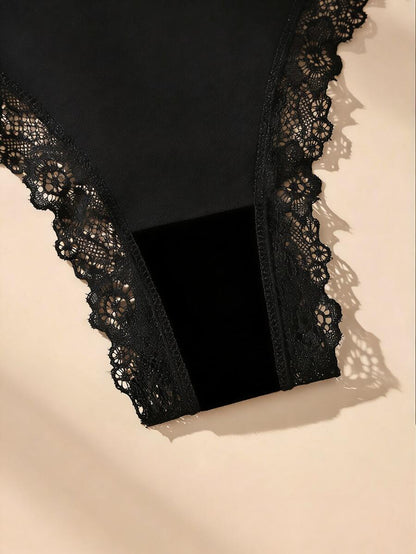 Conjunto de 5 calcinhas fio dental pretas de algodão com detalhes em renda e laço delicado. Modelo minimalista sem costura.