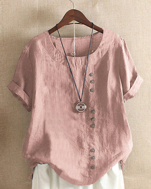 Damen Leinenbluse rosa, Kurzarm, Knopfleiste, lässig, Sommermode, hängend auf Holzkleiderbügel.