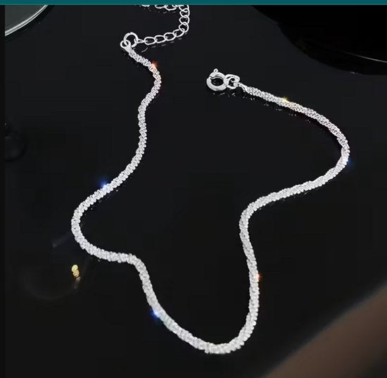 8721438304400 Zilverkleurig enkelbandje voor dames – dubbele laag – minimalistisch enkel sieraad – glanzend metaal – elegante enkelketting voor zomer en strand