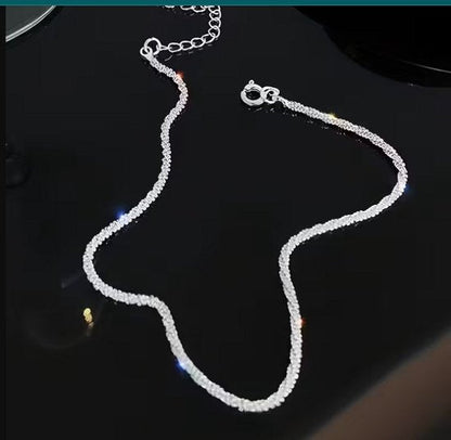8721438304400 Zilverkleurig enkelbandje voor dames – dubbele laag – minimalistisch enkel sieraad – glanzend metaal – elegante enkelketting voor zomer en strand