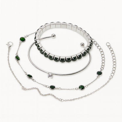 Set van 4 zilverkleurige armbanden voor dames – mix van schakel-, elastiek- en bangle designs met groene en transparante sierstenen