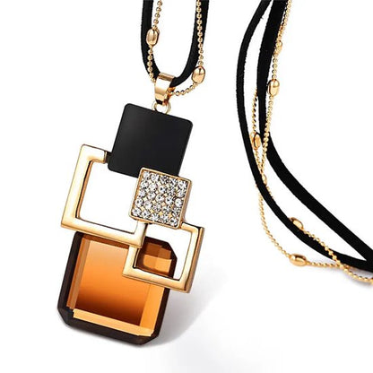 8721381459172 Zwart-goudkleurige ketting voor dames met geometrische hanger en bruine steen – ketting met hanger