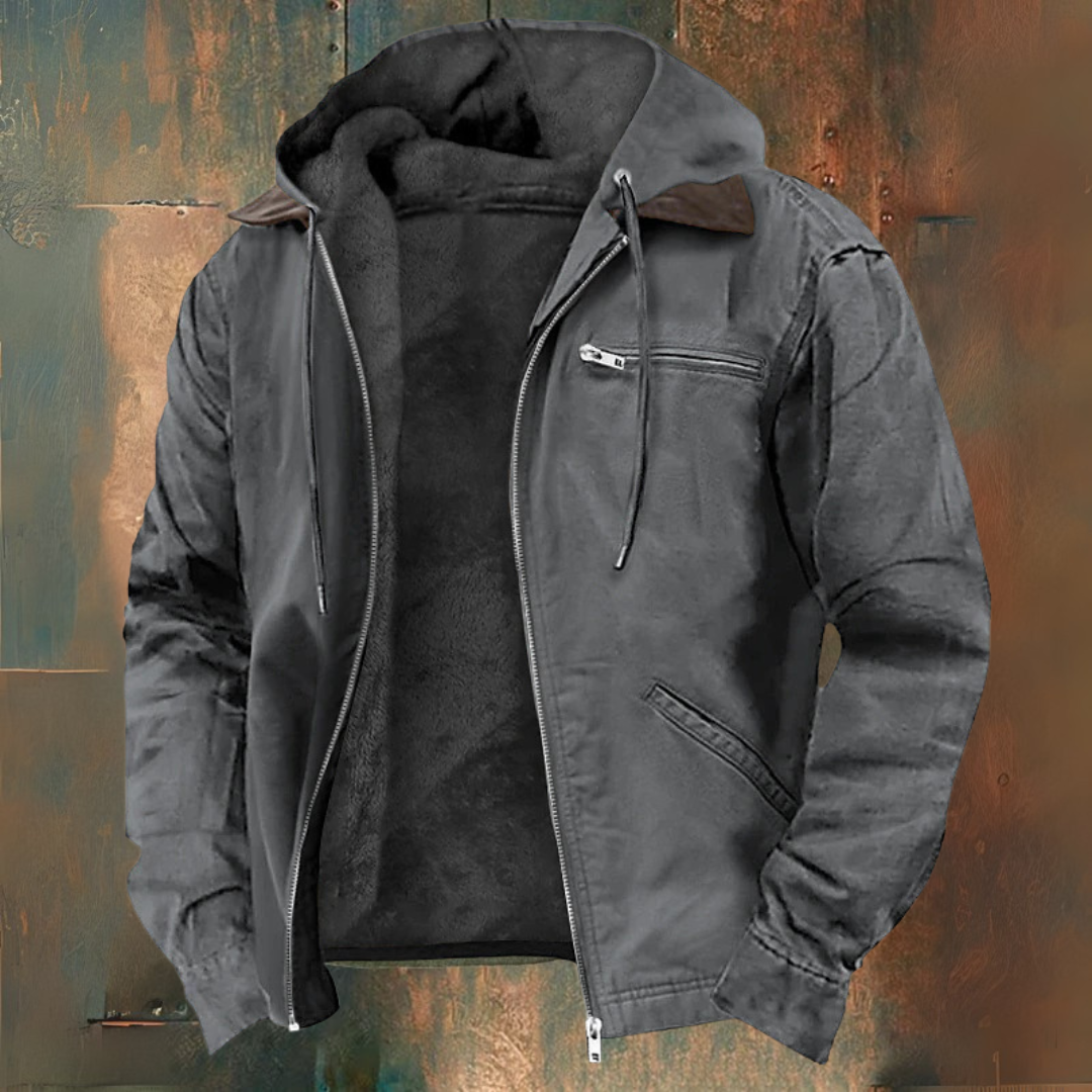 Veste à capuche en cuir gris pour homme, doublée de fourrure, avec fermeture éclair et poches, sur fond texturé. Mode masculine, hiver.