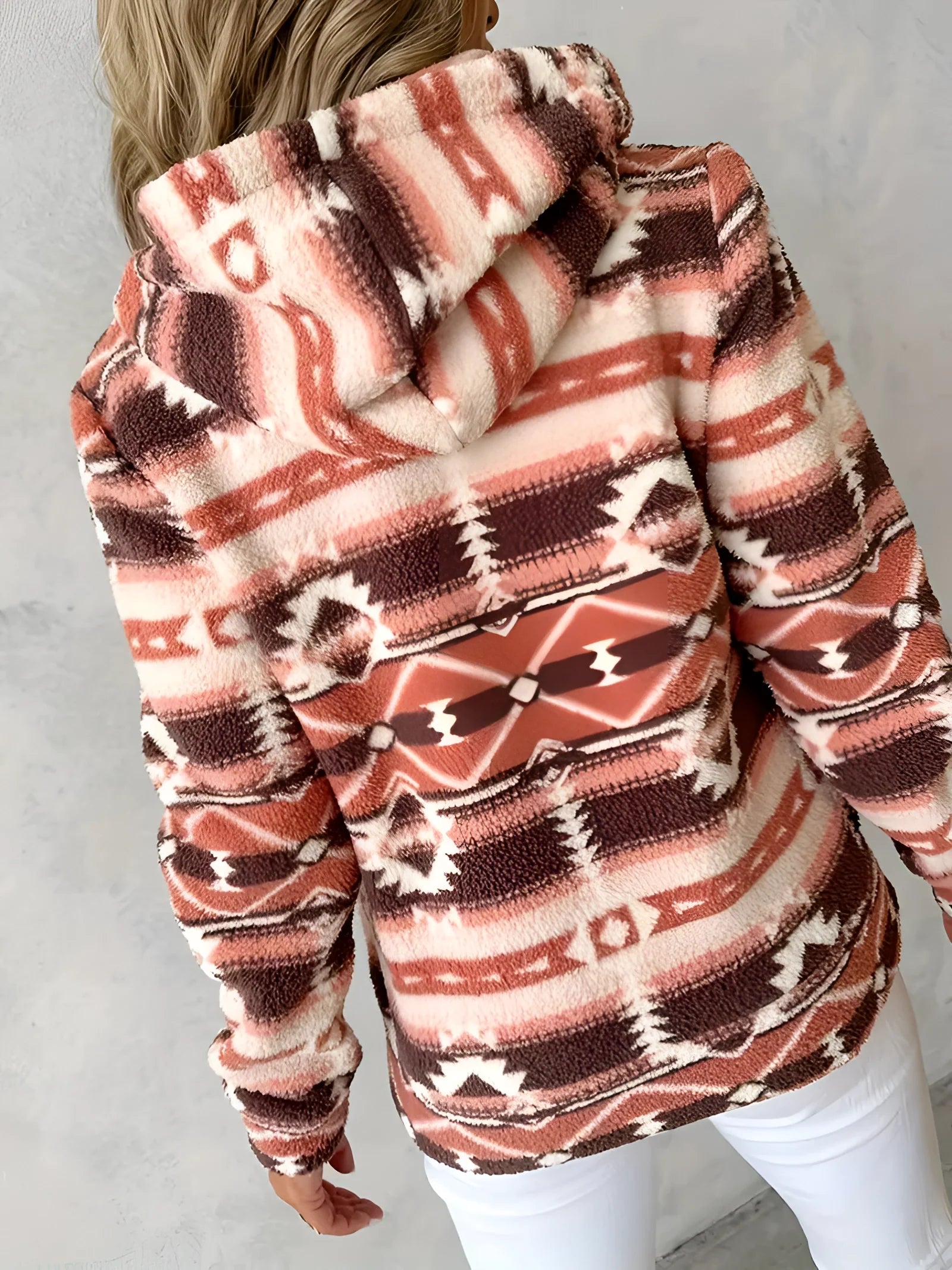 Cozy Women's Southwestern Plush Fleece Zip-Up Jacket featuring a soft fleece material with a stylish zip-up design, long sleeves, and a comfortable fit around the shoulders and neck.