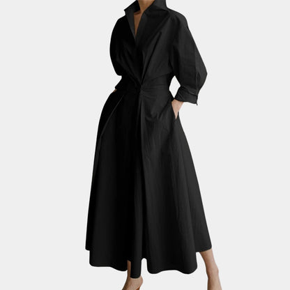 Elegant white midi trench coat with belted waist, 3/4 sleeves, and lightweight fabric.