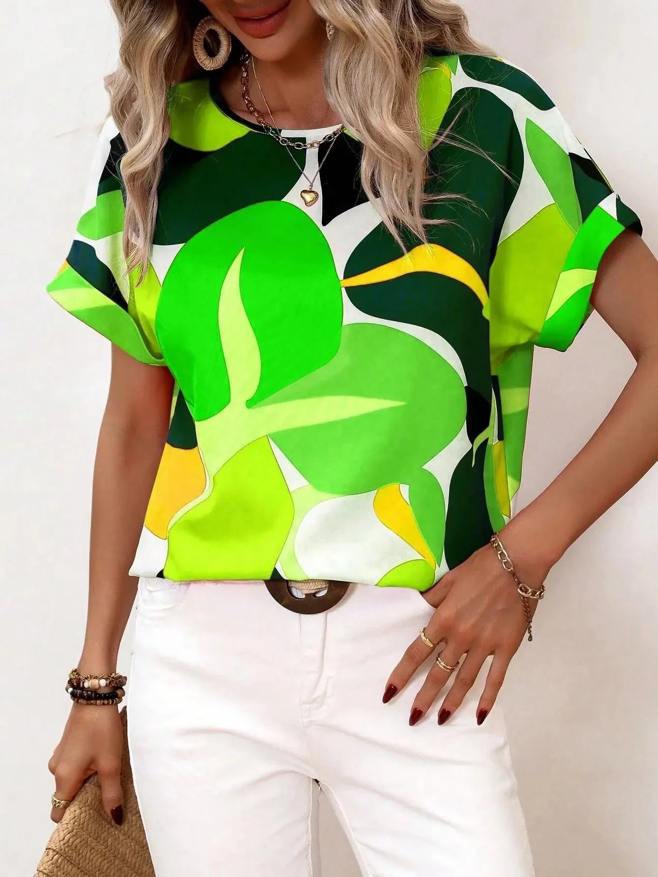 Women's green leaf print blouse, featuring short sleeves and a summer design, displayed in size 2XL.
