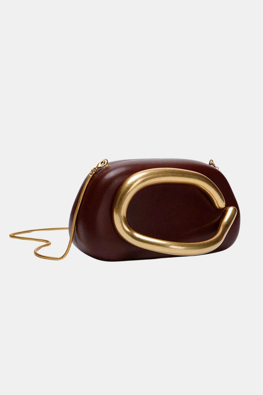 Camryn – Structured Clutch Bag with Sculptural Gold Accent