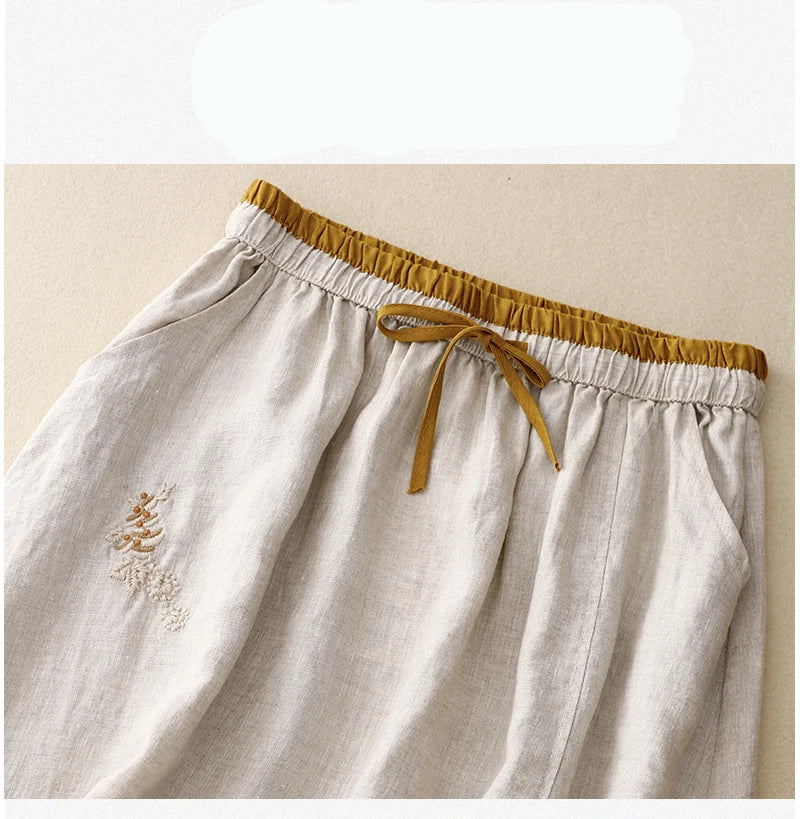 Light blue linen skirt with a relaxed fit and a flowy style, perfect for casual summer outings. 6