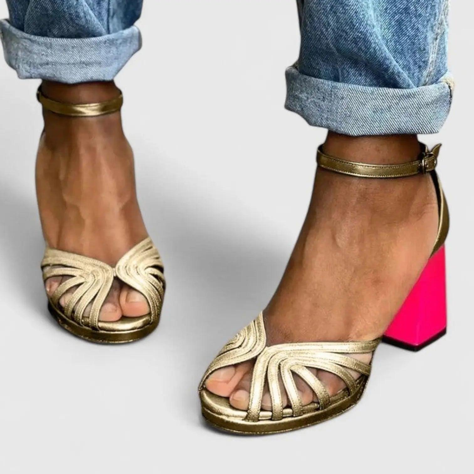 Women's heeled sandals with an ankle strap, featuring a sleek design and open toe. 1