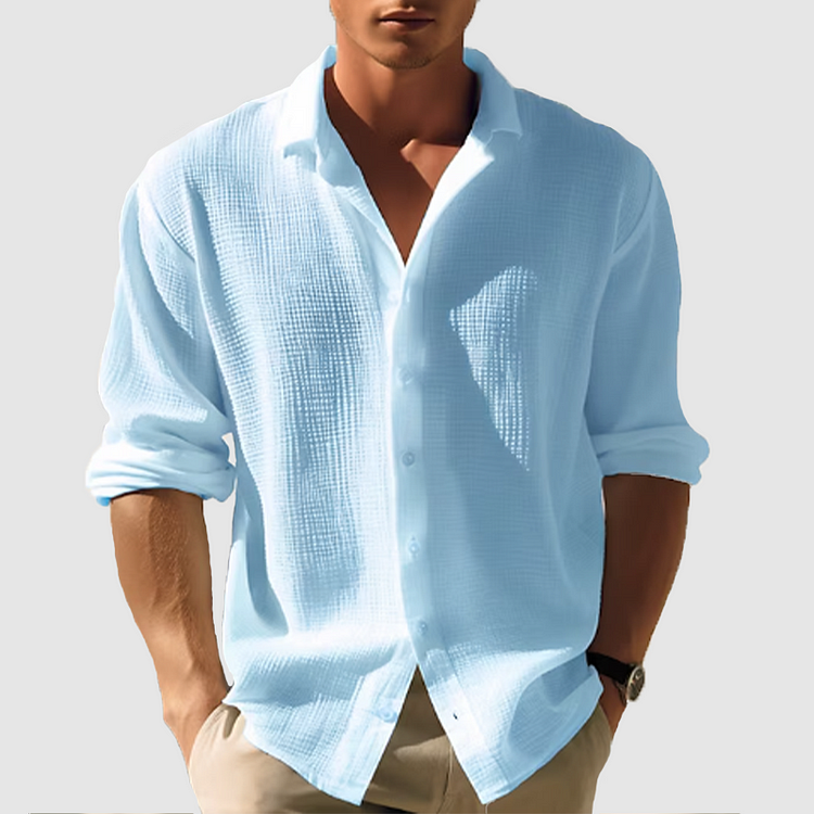 Men's long-sleeve white classic shirt displayed on a hanger, featuring a button-down collar and a straight cut. 0