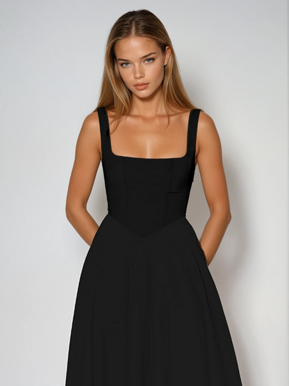 Midi dress featuring a square neckline and wide straps, designed for elegant occasions. The dress has a fitted bodice and a flowing skirt that falls to mid 4