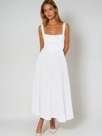 Midi dress featuring a square neckline and wide straps, designed for elegant occasions. The dress has a fitted bodice and a flowing skirt that falls to mid 9