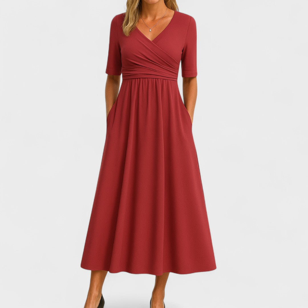 A women's midi dress featuring an A-line silhouette, designed for summer wear. The dress has a flowing shape that falls below the knee, showcasing a stylish 5