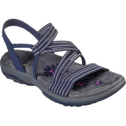 Sandale femme bleue à lanières croisées, semelle intérieure rembourrée grise, motif géométrique, idéale pour confort et style estival.