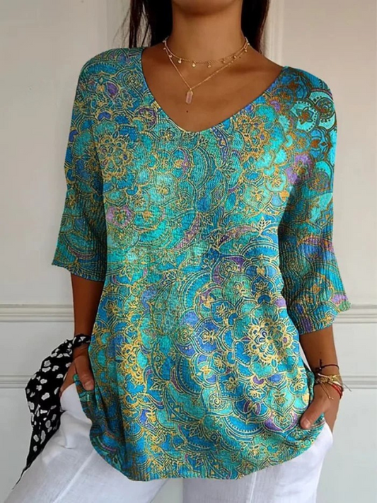 Kynelle - Vrouwelijke blouse met een vloeiende print, V-hals en uitlopende mouwen in elegante boho-stijl