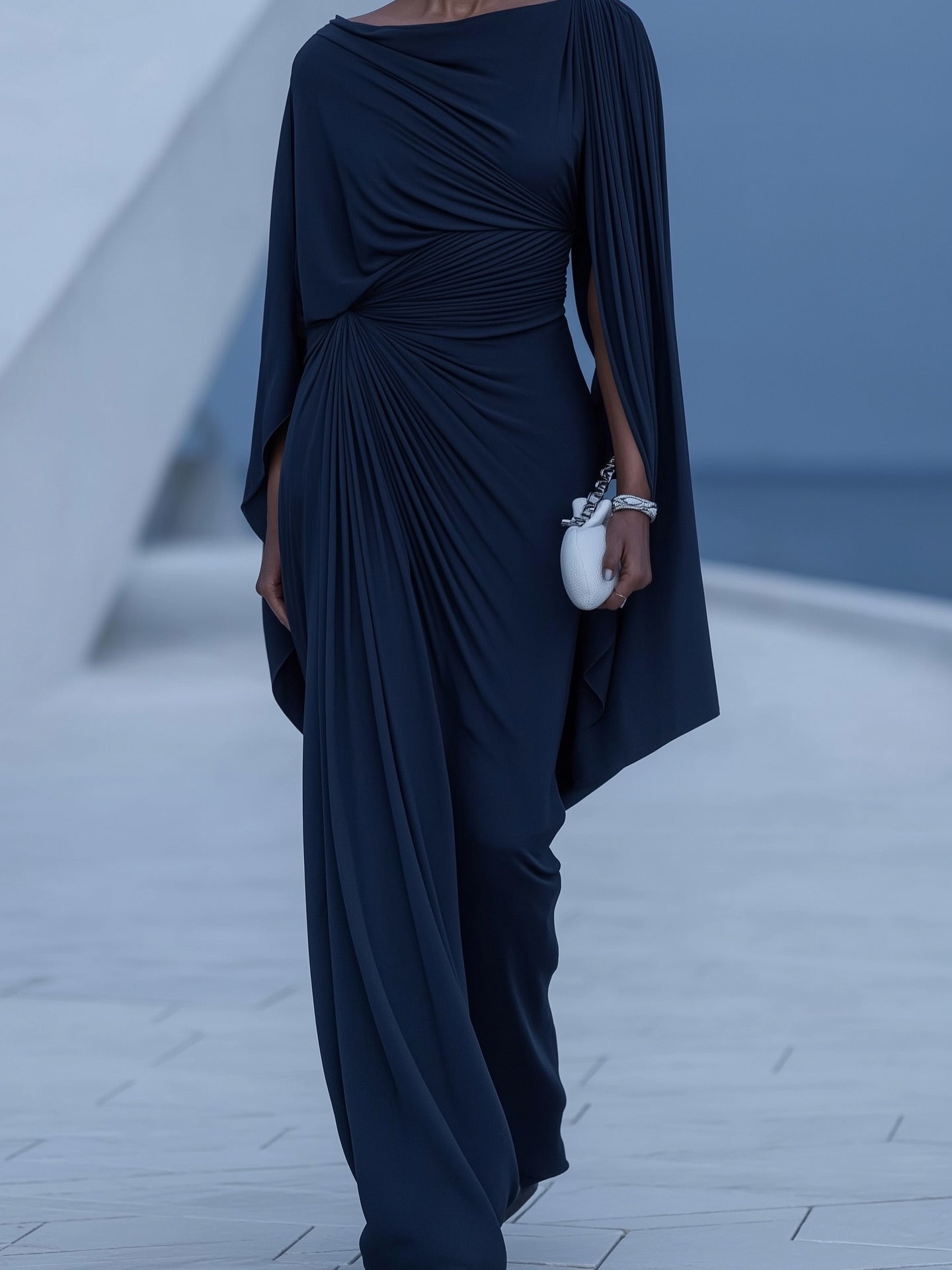 Elegant and sophisticated long pleated dress with dark blue cape