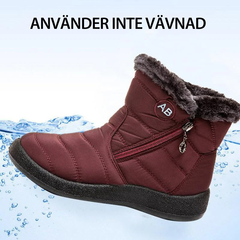Botte d'hiver imperméable rouge avec doublure en fourrure, fermeture éclair latérale et semelle antidérapante, idéale pour temps froid et humide.