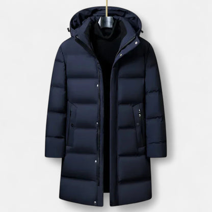 Doudoune longue bleu marine avec capuche, fermeture éclair, poches latérales. Manteau hiver chaud, élégant, idéal pour temps froid.
