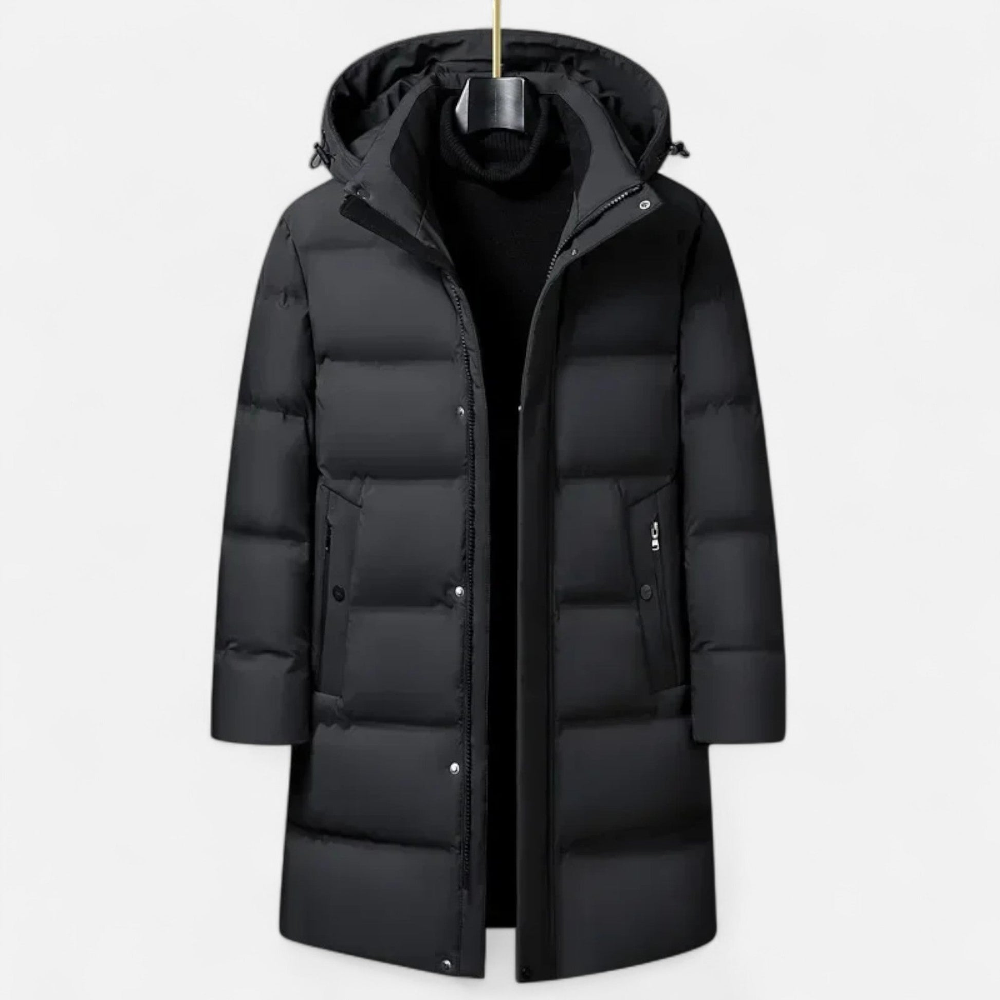 Manteau d'hiver noir pour homme, long et matelassé, avec capuche amovible. Idéal pour temps froid. Mode masculine, vêtement chaud et élégant.
