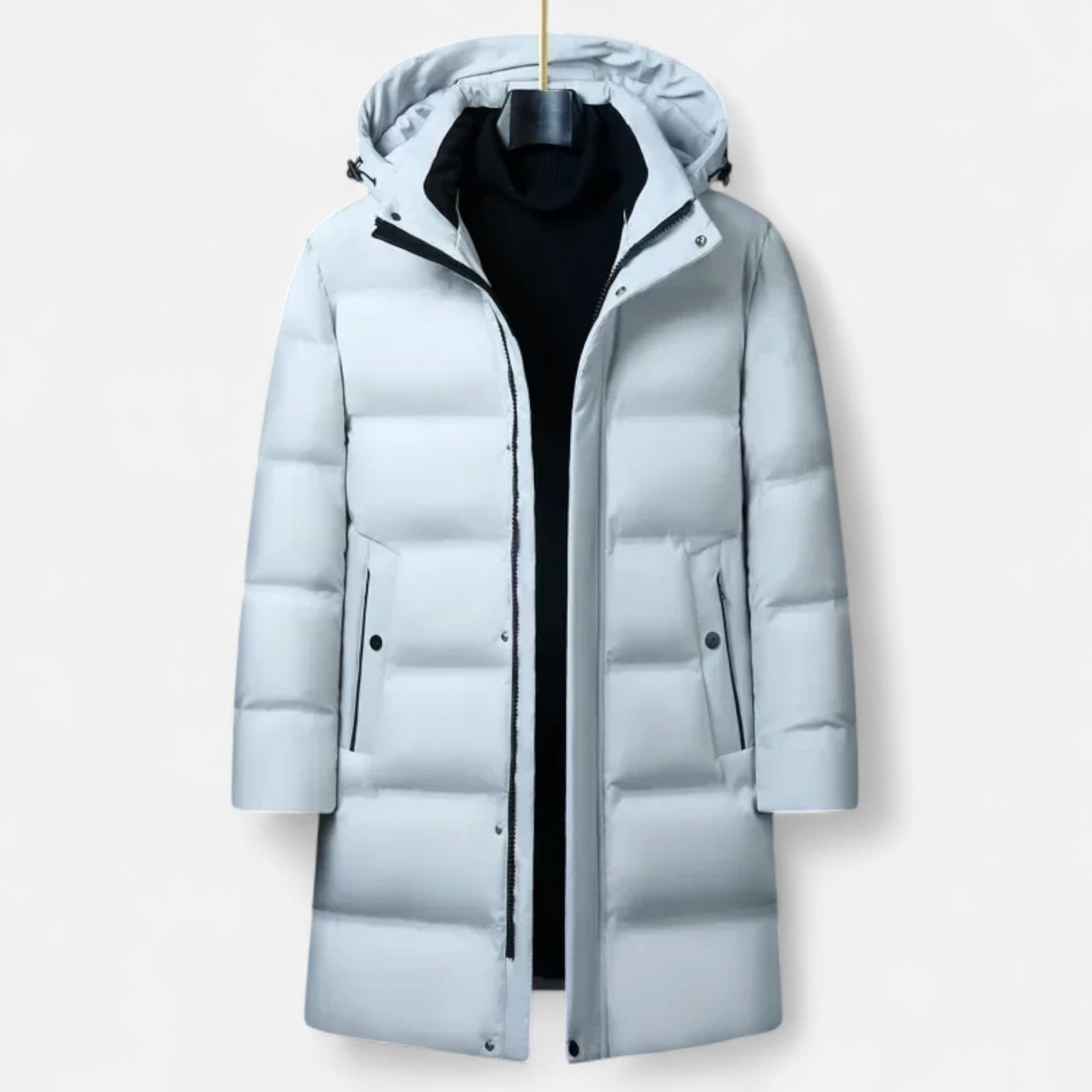 Doudoune longue blanche avec capuche, design moderne, idéale pour l'hiver. Veste matelassée chaude, fermeture éclair, poches latérales.