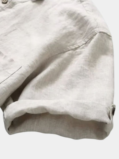 Light beige Montaracrest linen shirt with a classic collar and button front, displayed on a neutral background.