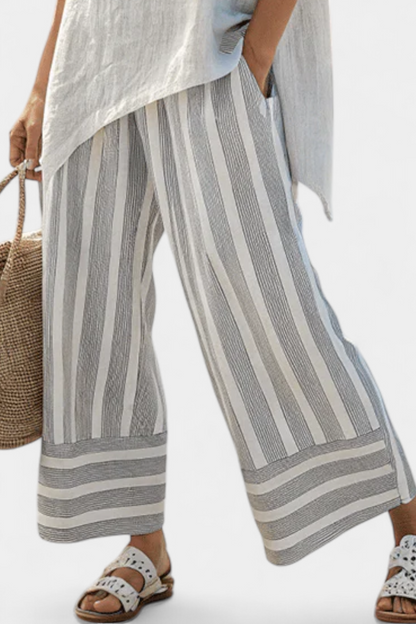 Elle – Elegant Asymmetric Blouse and Striped Trousers