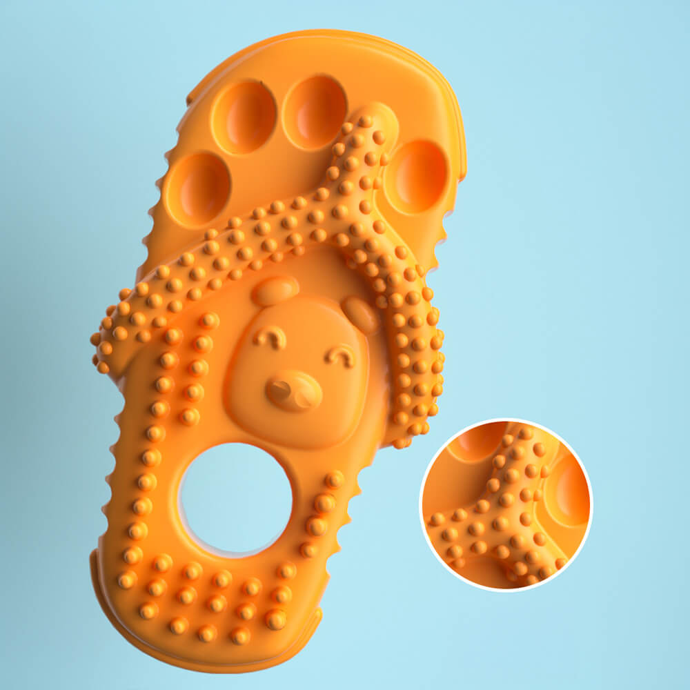 Orange Hundekauspielzeug in Pantoffelform, wasserdicht, bissfest, Zahnpflege, auf blauem Hintergrund.