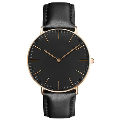 Schwarze Armbanduhr mit Lederarmband, minimalistisches Design, goldene Akzente, Unisex-Uhr.