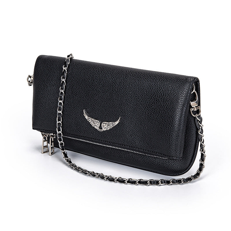 Gesteppte Clutch mit Kettentrageriemen – Elegant und vielseitig Zorenza