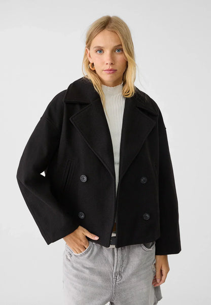 Manteau court pour femme avec double rangée de boutons et design intemporel